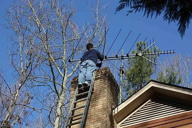 Professional chimney cleaning service in action
